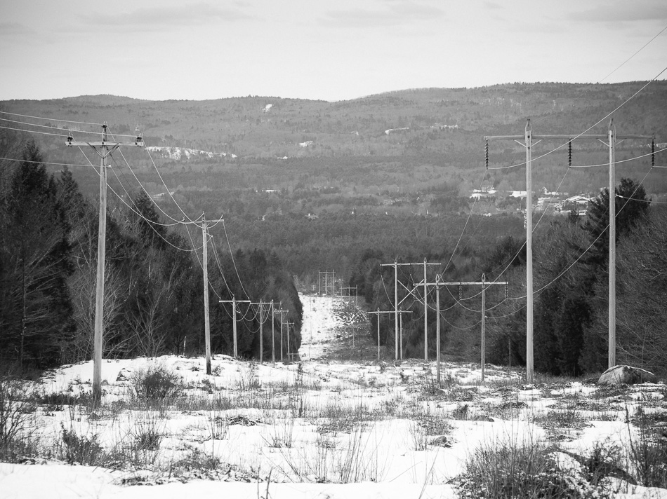 Electrical transmission lines running down a hill