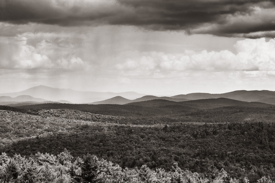 A rainstorm in the distance as seen from atop Pitcher Mountain