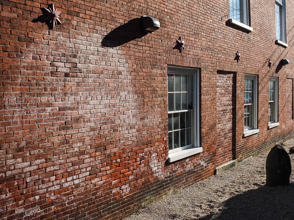 Color photo of a brick alley in Peterborough, NH