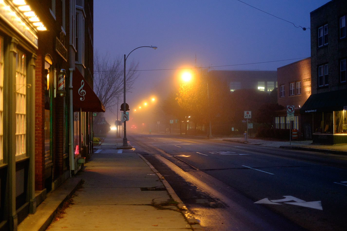 Color photo looking down West Street on a foggy morning in Keene, NH