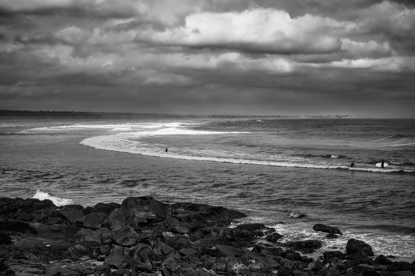 Black and white photo of surfers taking advantage of Hurricane Gonzalo's waves