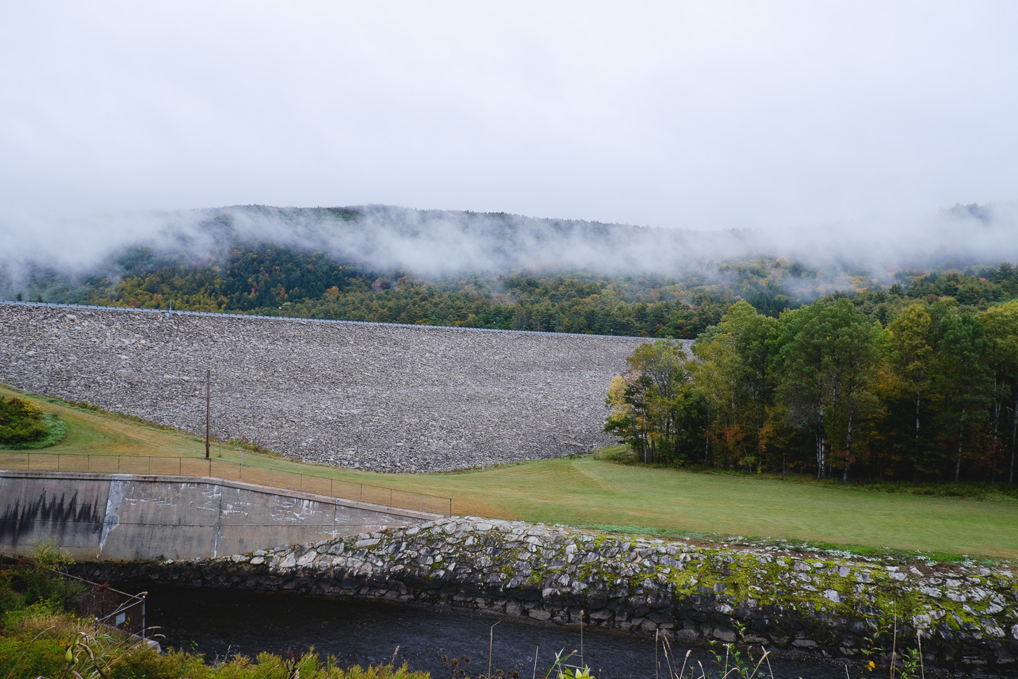 Color photo showing the view of the Southern face of Surry Mountain Dam