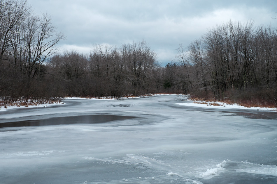 Color photo of a frozen Ashuelot River in Keene, NH