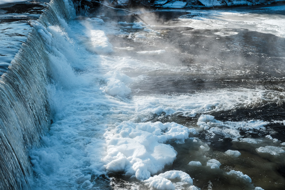Color photo of ice at the base of the Ashuelot River Dam in Keene, NH