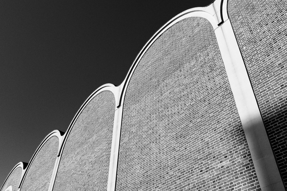 Black and white photo of a curvy brick facade in Hanover, NH