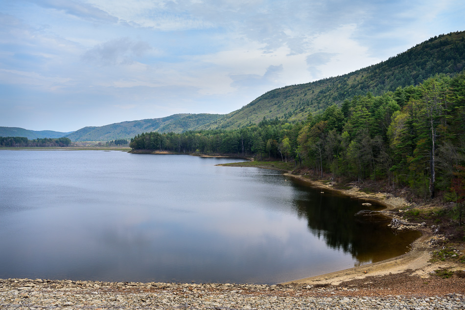 Color photo showing the view of the reservoir from atop the Surry Mountain Dam