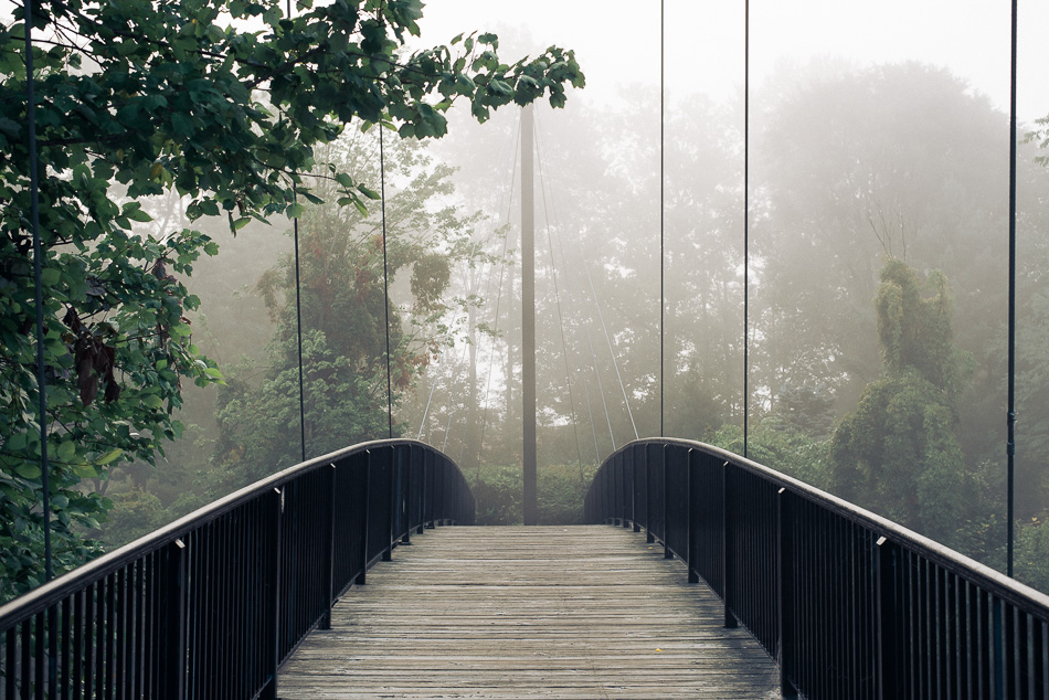 Fog obscures the footbridge in the Ashuelot River Park