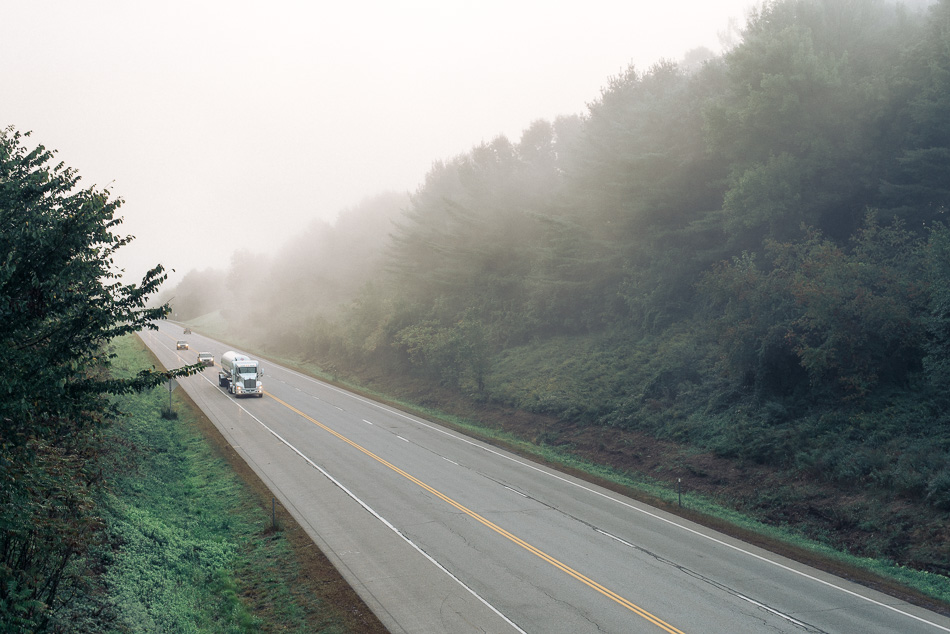 A truck heads west on a foggy Route 9 in Keene, NH